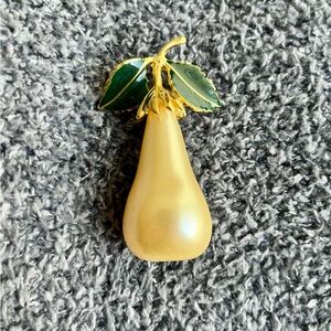Kenneth Lane vintage brooch. Large pear shaped pearl with green enamel leaves.